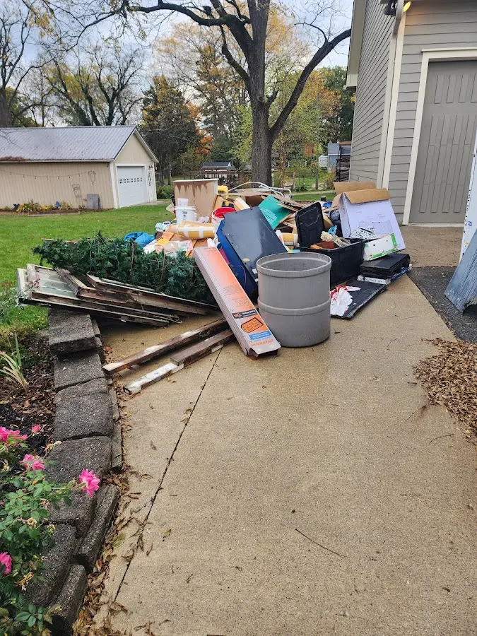 Dumpster being loaded with debris for 30 Yard Dumpster Rental in Poquoson